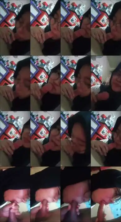 Jilbab hitam kacamata baju putih nyepon...